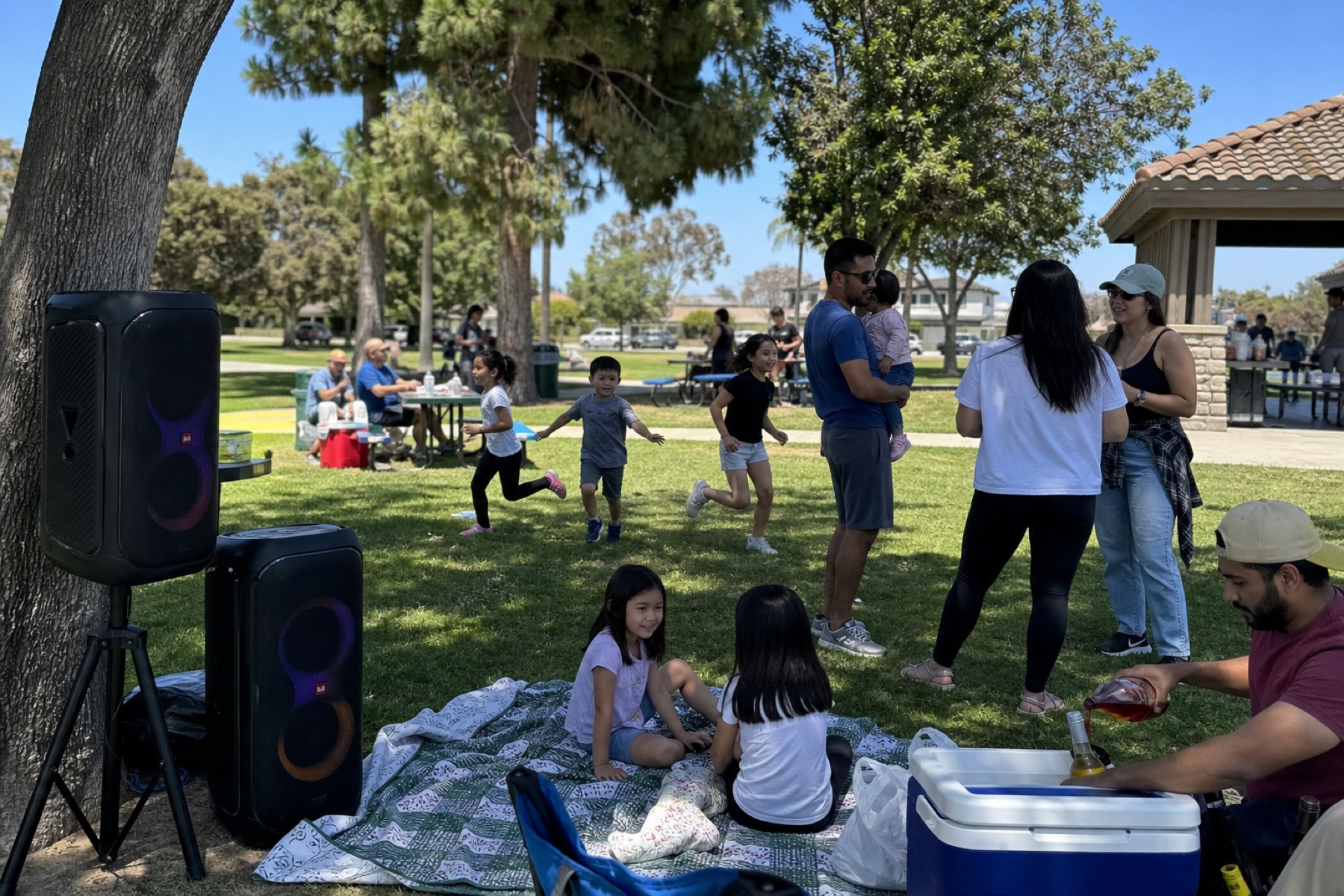 Families at a South Bay park with Chungry Events speakers set up under the trees